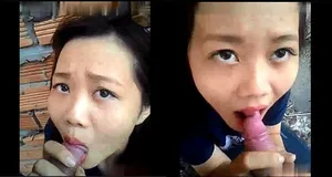 Em ghệ mút chuối ở vườn sau nhà
